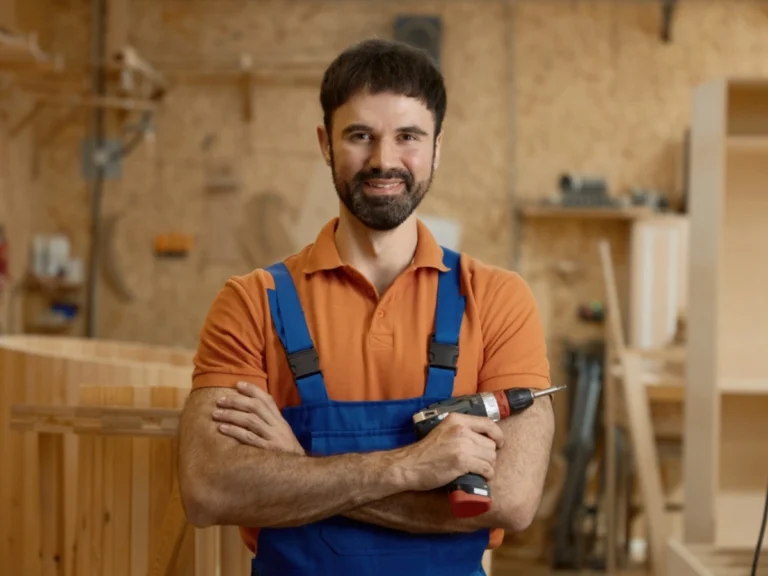 Skilled technician in workshop wearing durable coverall uniform UAE designed for comfort, safety, and daily industrial work