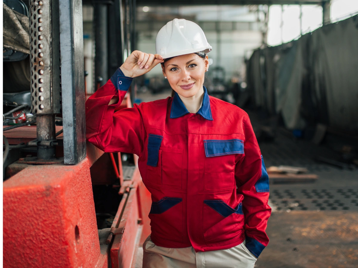 Female worker in Climate-Adaptive Uniforms UAE, engineered for durability, breathability, and safety in industrial environments.